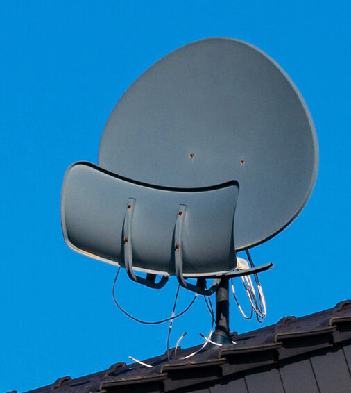 three-satellite-dishes-roof-tiled-house-blue-sky